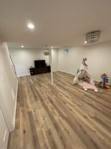A picture of an empty room with a wooden flooring