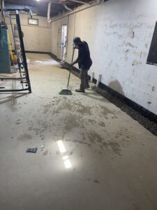 A worker cleaning out the dust