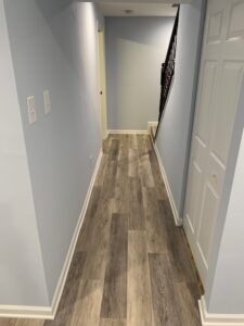 A narrow hallway in the basement