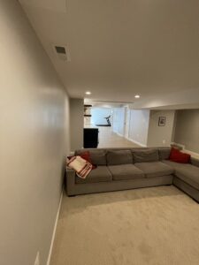 An L-shaped sofa set in the basement