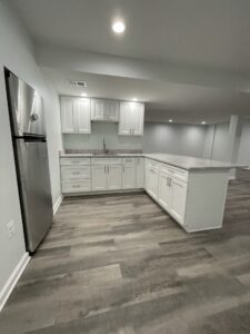 White cabinetry and countertops in a room