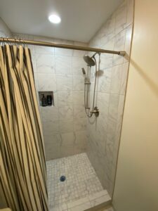 A shower area with a curtain