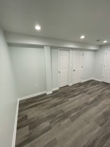 White doors and walls with a brown flooring