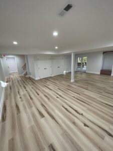 A basement room with white walls and wide space