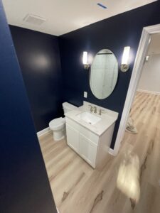 A dark blue bathroom vanity