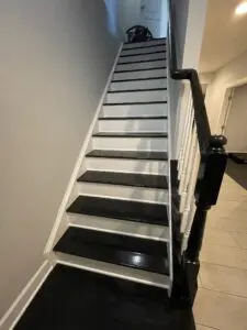 A staircase with a black surface