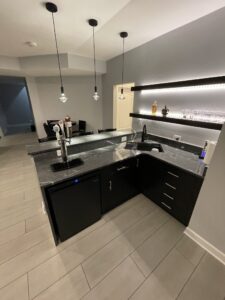 Kitchen countertops and a bar in the basement
