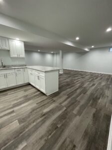 White cabinetry and countertops in an empty room