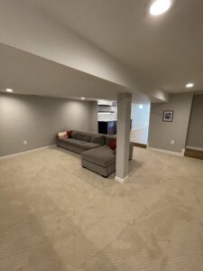 A basement room with furniture