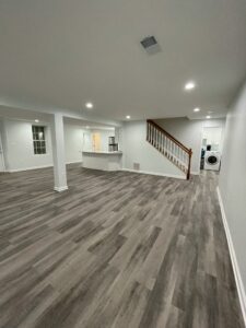 A wide basement space and staircase