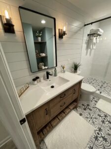 A bathroom vanity and mirror