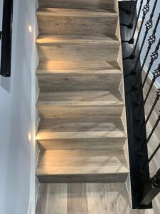 Wooden staircase flooring and lighting